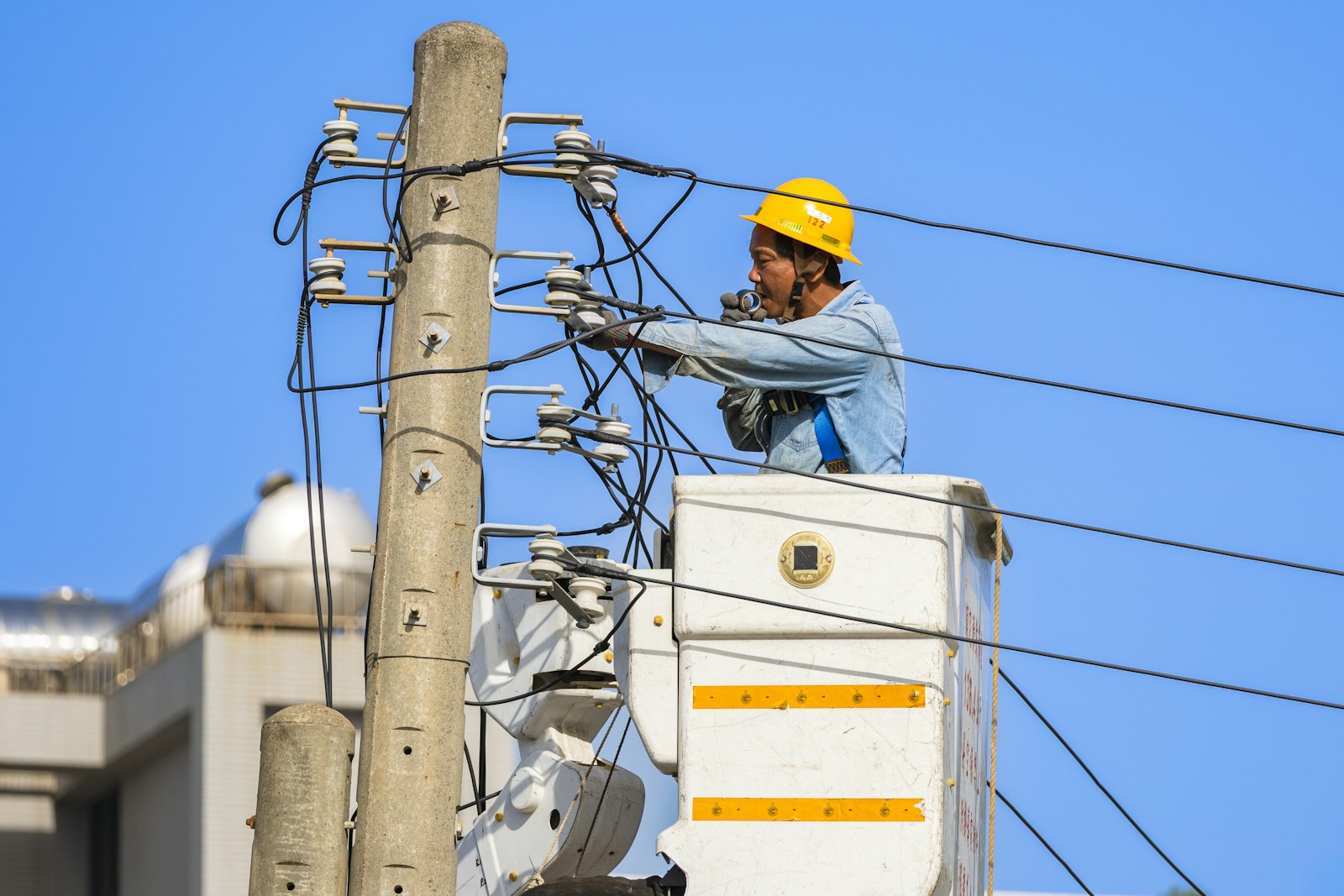 Technician performing high voltage testing on a transformer
